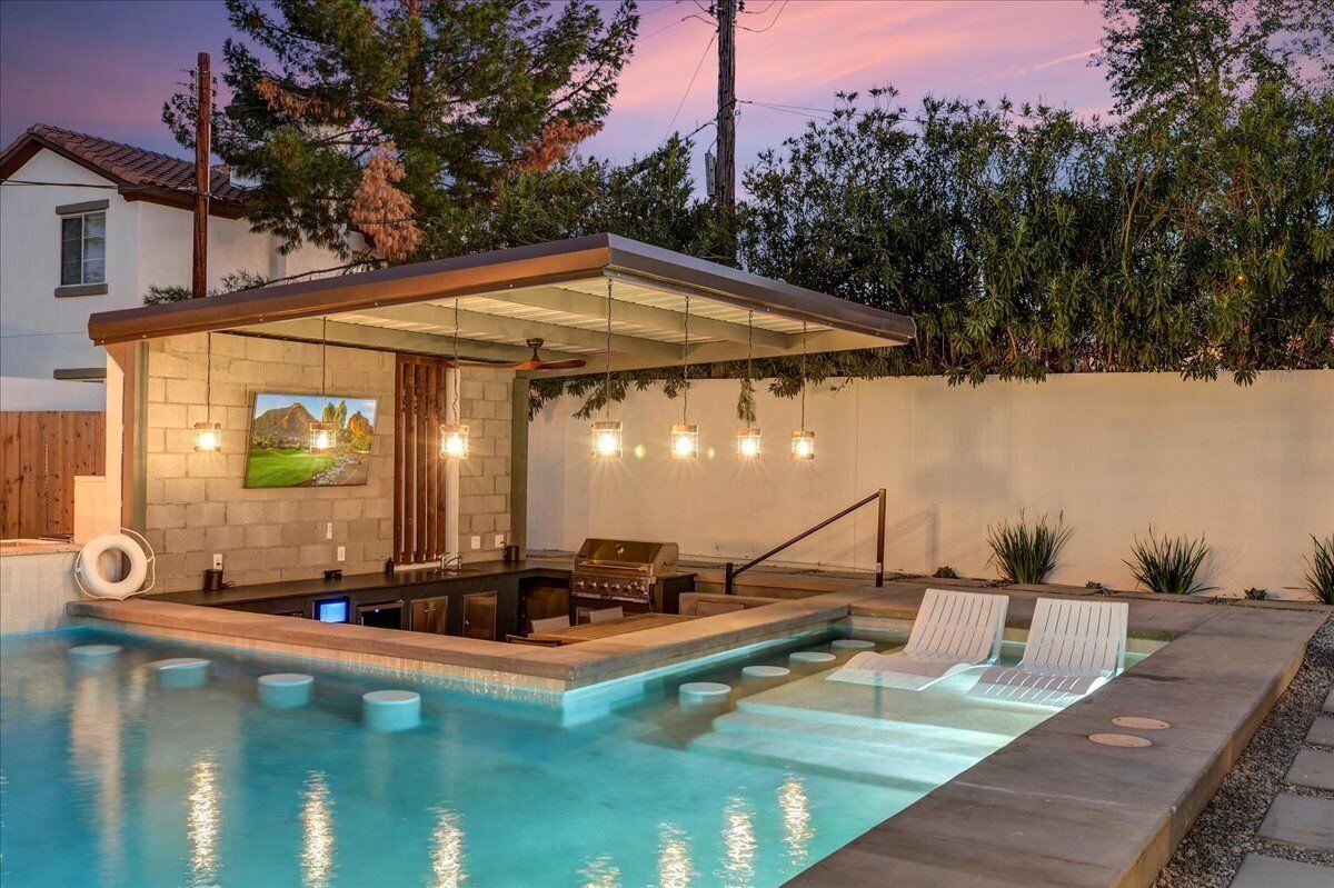 Sunken in-pool bar seating at dusk