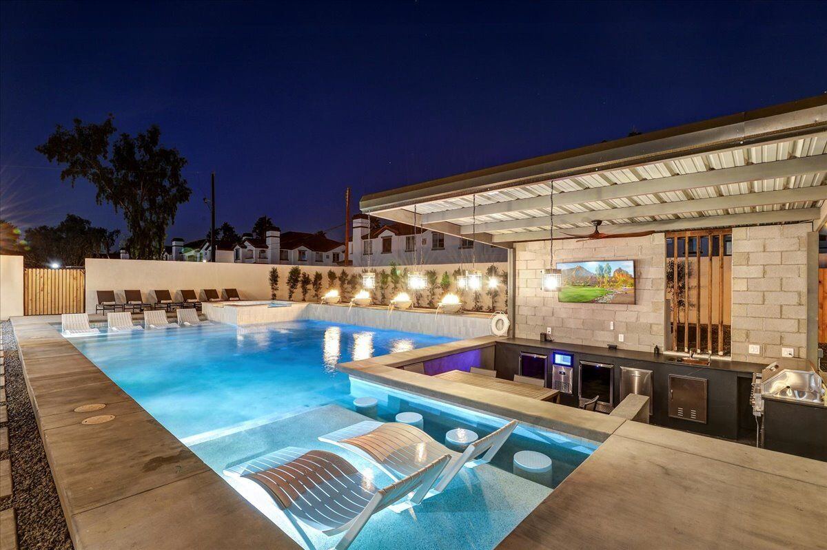 Sunken in-pool bar seating at night